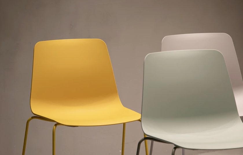 three chairs of different colors